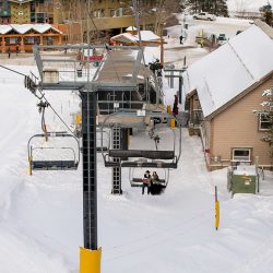 Don't miss the black gown and ski lift ride at this crisp winter elopement