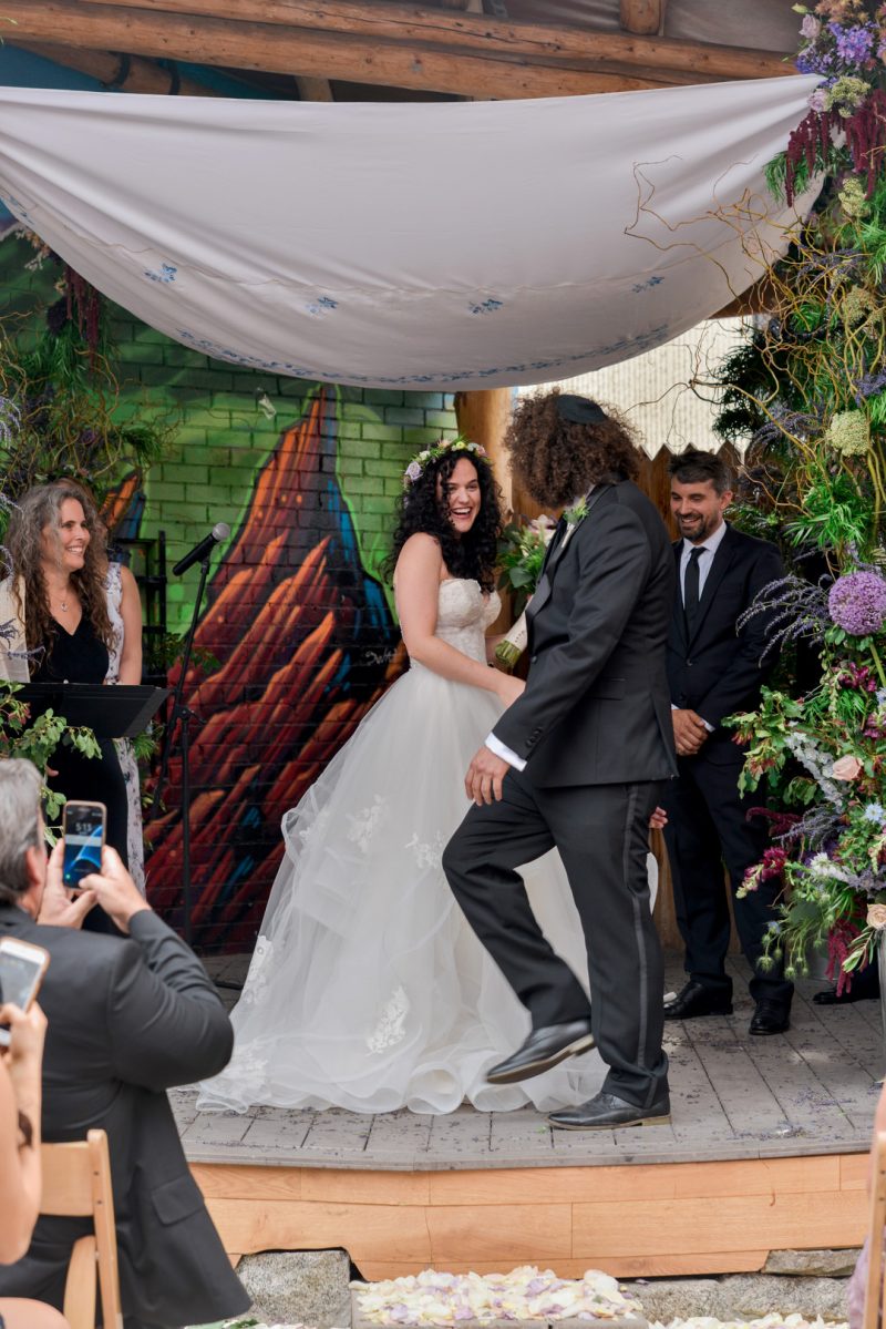 Don't miss the floral dresses, colorful art, and live band at this adorable Colorado wedding