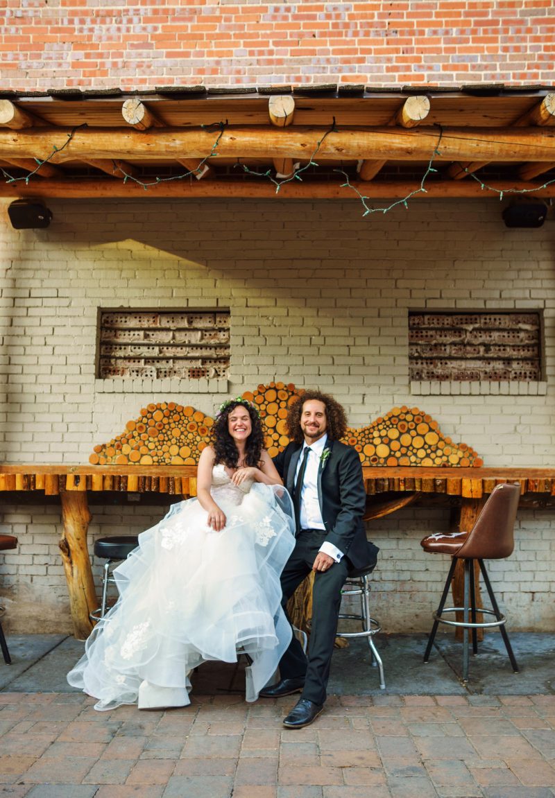 Don't miss the floral dresses, colorful art, and live band at this adorable Colorado wedding