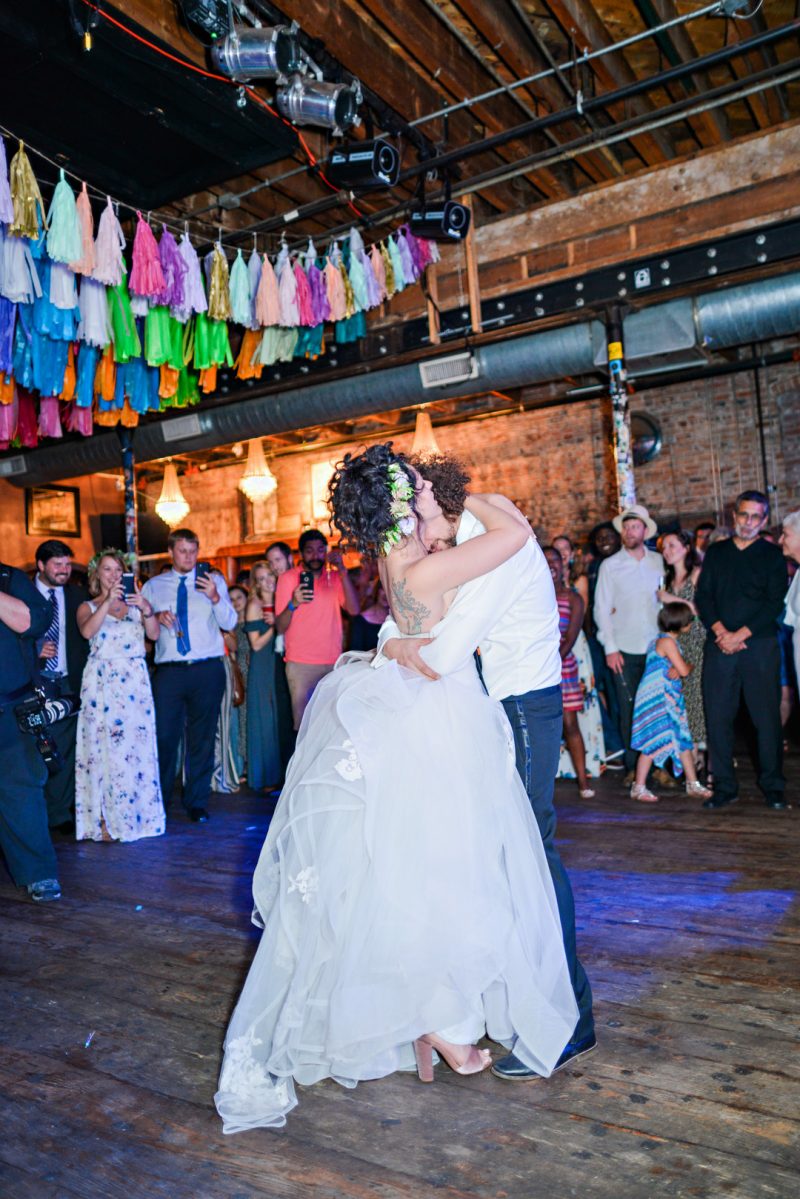 Don't miss the floral dresses, colorful art, and live band at this adorable Colorado wedding