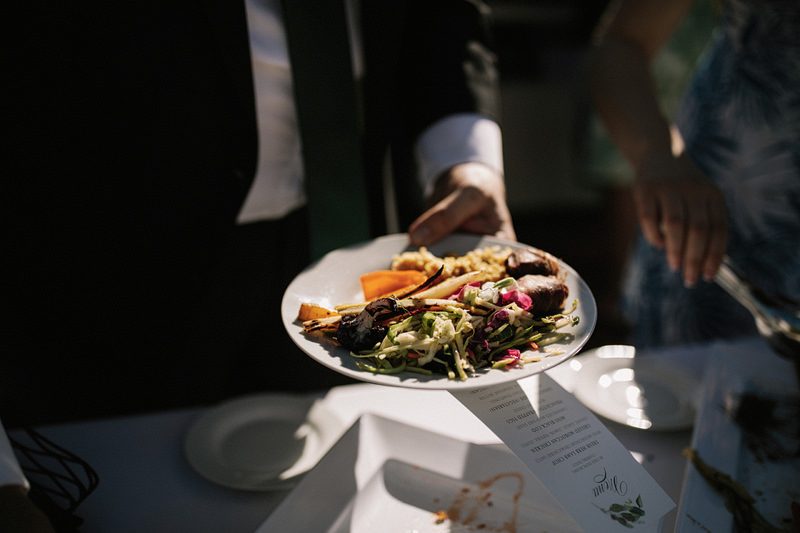 A backyard garden party wedding with yard games & cocktail recipe cards