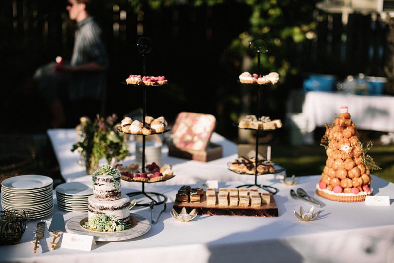 A backyard garden party wedding with yard games & cocktail recipe cards