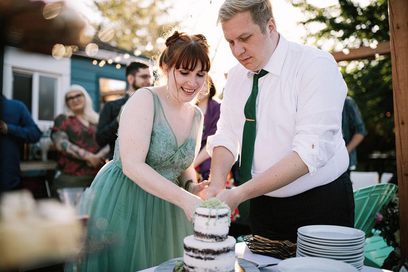 A backyard garden party wedding with yard games & cocktail recipe cards
