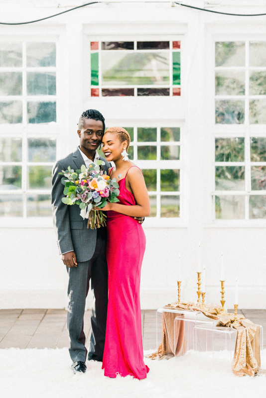 Be blown away by the stunning hot pink dress at this greenhouse elopement shoot