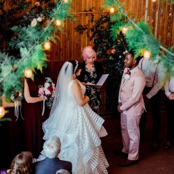 You'll need to fan yourself from the pink suit & striped dress at this romantic brunch wedding