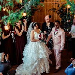 You'll need to fan yourself from the pink suit & striped dress at this romantic brunch wedding