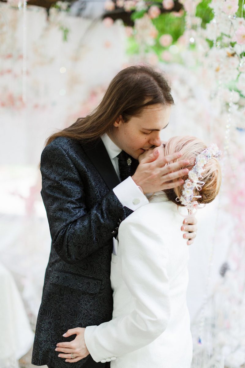 A fairy tale genderfluid cherry blossom vow renewal with a dress-to-suit swap(!)