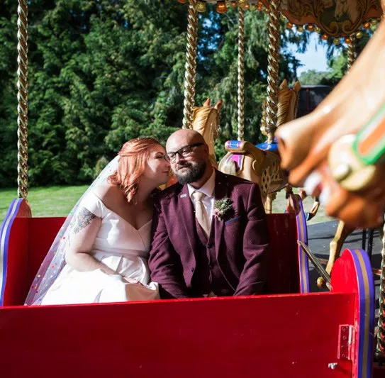 This outdoor carousel wedding had rainbow decor and a doggy bridesmaid