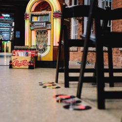 It's guitars & malt shop love at this retro diner-themed wedding