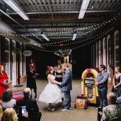 It's guitars & malt shop love at this retro diner-themed wedding