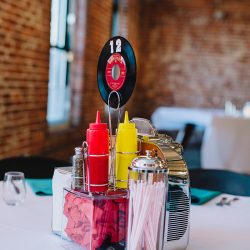 It's guitars & malt shop love at this retro diner-themed wedding
