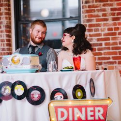 It's guitars & malt shop love at this retro diner-themed wedding