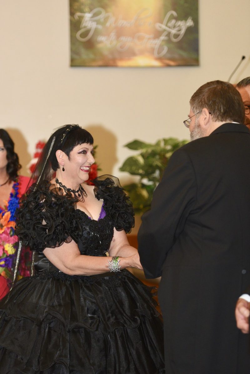 This bride bought her black dress 30 year ago and finally got to wear it at her spooktacular wedding