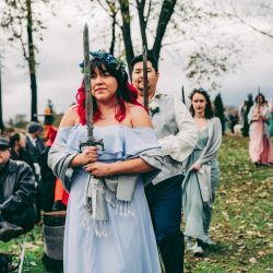 Spot the pups, swords, & EPIC cape at this fantasy themed wedding