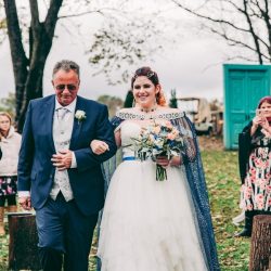Spot the pups, swords, & EPIC cape at this fantasy themed wedding