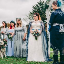 Spot the pups, swords, & EPIC cape at this fantasy themed wedding