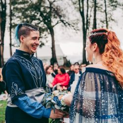 Spot the pups, swords, & EPIC cape at this fantasy themed wedding