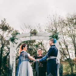 Spot the pups, swords, & EPIC cape at this fantasy themed wedding