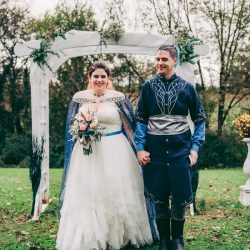 Spot the pups, swords, & EPIC cape at this fantasy themed wedding