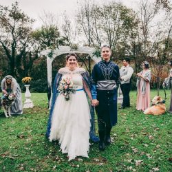 Spot the pups, swords, & EPIC cape at this fantasy themed wedding