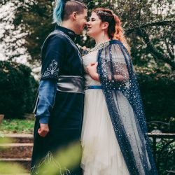 Spot the pups, swords, & EPIC cape at this fantasy themed wedding