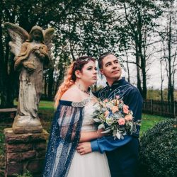 Spot the pups, swords, & EPIC cape at this fantasy themed wedding