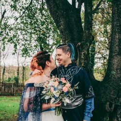Spot the pups, swords, & EPIC cape at this fantasy themed wedding