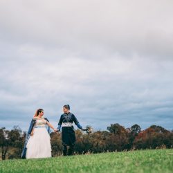 Spot the pups, swords, & EPIC cape at this fantasy themed wedding