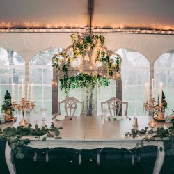 Spot the pups, swords, & EPIC cape at this fantasy themed wedding