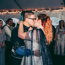 Spot the pups, swords, & EPIC cape at this fantasy themed wedding