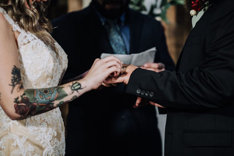 Ink, roses, & tequila shots at this goth meets spring wedding at Lafitte Street Market