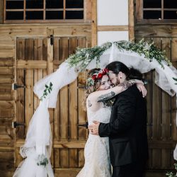 Ink, roses, & tequila shots at this goth meets spring wedding at Lafitte Street Market