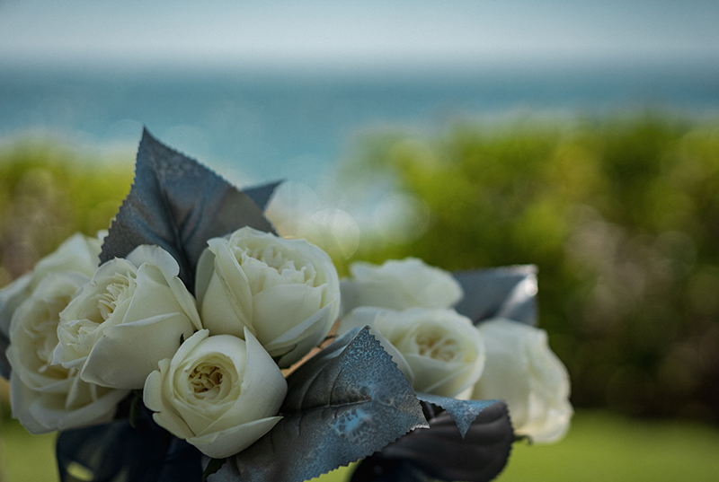 A romantic O'ahu wedding with two grooms, a beachside ceremony, & jumping the "groomstick"
