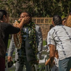 A romantic O'ahu wedding with two grooms, a beachside ceremony, & jumping the "groomstick"