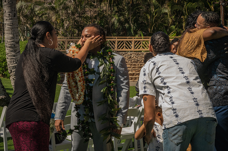 A romantic O'ahu wedding with two grooms, a beachside ceremony, & jumping the "groomstick"