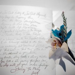 A romantic O'ahu wedding with two grooms, a beachside ceremony, & jumping the "groomstick"
