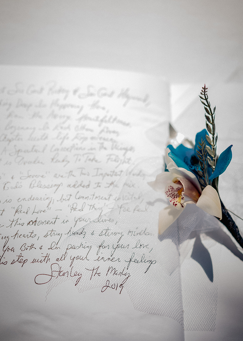 A romantic O'ahu wedding with two grooms, a beachside ceremony, & jumping the "groomstick"