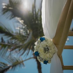 A romantic O'ahu wedding with two grooms, a beachside ceremony, & jumping the "groomstick"