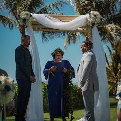 A romantic O'ahu wedding with two grooms, a beachside ceremony, & jumping the "groomstick"