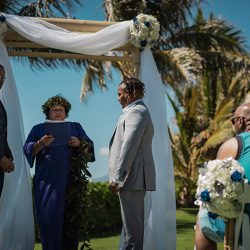 A romantic O'ahu wedding with two grooms, a beachside ceremony, & jumping the "groomstick"