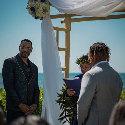 A romantic O'ahu wedding with two grooms, a beachside ceremony, & jumping the "groomstick"