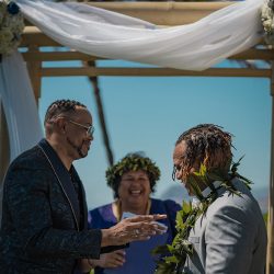 A romantic O'ahu wedding with two grooms, a beachside ceremony, & jumping the "groomstick"