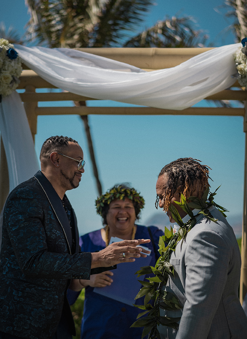 A romantic O'ahu wedding with two grooms, a beachside ceremony, & jumping the "groomstick"