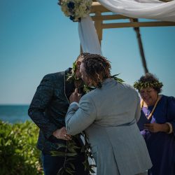 A romantic O'ahu wedding with two grooms, a beachside ceremony, & jumping the "groomstick"