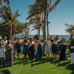 A romantic O'ahu wedding with two grooms, a beachside ceremony, & jumping the "groomstick"
