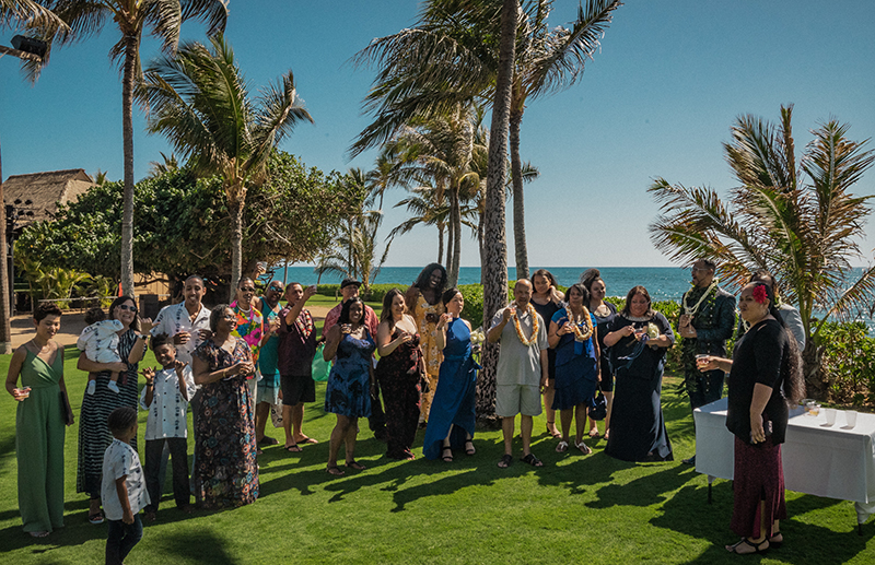 A romantic O'ahu wedding with two grooms, a beachside ceremony, & jumping the "groomstick"