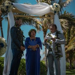 A romantic O'ahu wedding with two grooms, a beachside ceremony, & jumping the "groomstick"