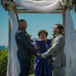 A romantic O'ahu wedding with two grooms, a beachside ceremony, & jumping the "groomstick"
