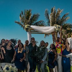 A romantic O'ahu wedding with two grooms, a beachside ceremony, & jumping the "groomstick"