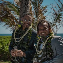 A romantic O'ahu wedding with two grooms, a beachside ceremony, & jumping the "groomstick"